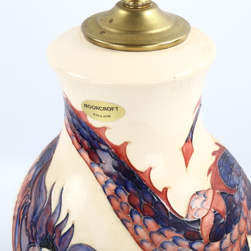 1093 - Moorcroft pottery dragon design table lamp with brass mounts, height excluding fitting 30cm