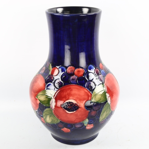 1095 - Large Moorcroft pottery Pomegranate and Grape pattern vase, height 35cm, restored