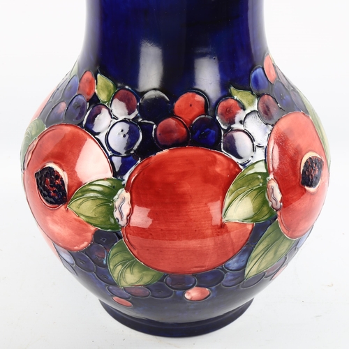 1095 - Large Moorcroft pottery Pomegranate and Grape pattern vase, height 35cm, restored