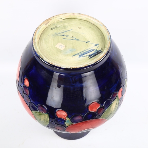 1095 - Large Moorcroft pottery Pomegranate and Grape pattern vase, height 35cm, restored