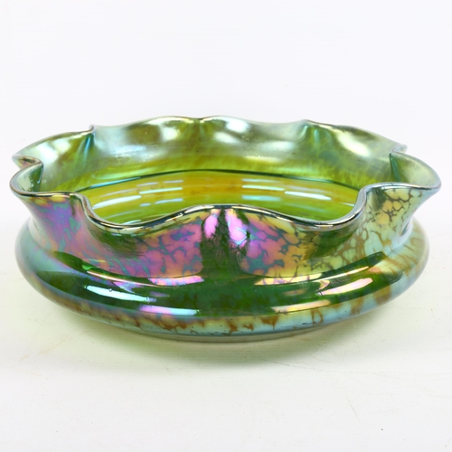 1121 - A Loetz green iridescent glass bowl with frilled rim, diameter 24cm