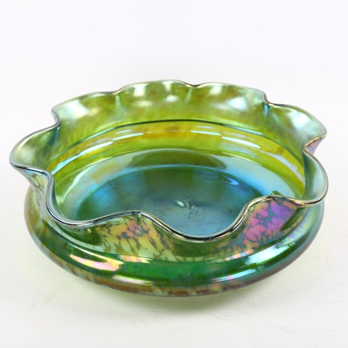 1121 - A Loetz green iridescent glass bowl with frilled rim, diameter 24cm