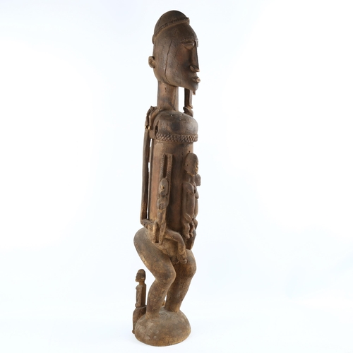 1135 - A large African Dogon Tribal carved wood fertility figure, height 90cm