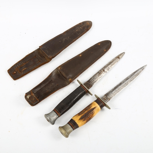 1162 - 2 Second World War period daggers in sheaths, both with makers marks William Rodgers, Sheffield, lon... 