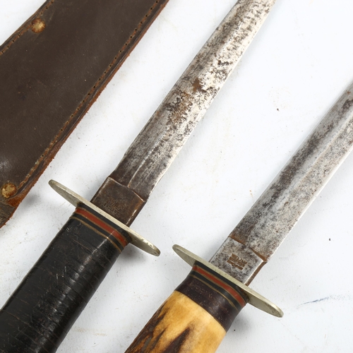 1162 - 2 Second World War period daggers in sheaths, both with makers marks William Rodgers, Sheffield, lon... 