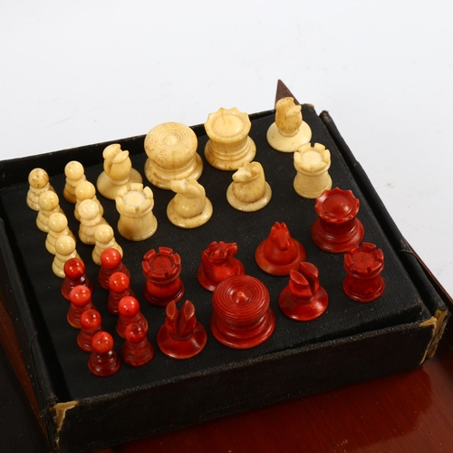 1166 - A 19th century travelling chess board, boxwood and ebony, with part chess set, together with a 19th ... 