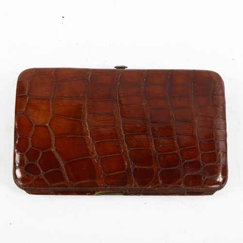 1169 - A Victorian crocodile skin cigar case with silver clip, hallmarks London 1888, 17cm x 10cm