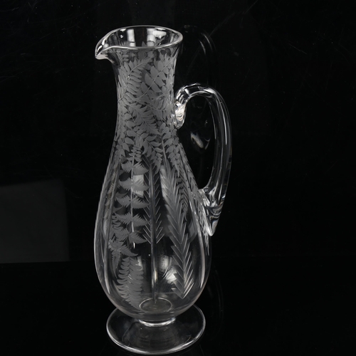 1198 - A Victorian glass wine ewer and matching stemmed glass, with wheel-cut fern decoration, glass inscri... 