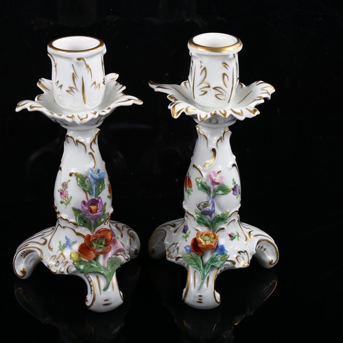 1216 - A pair of Dresden gilded porcelain candlesticks with floral mounts, height 16cm