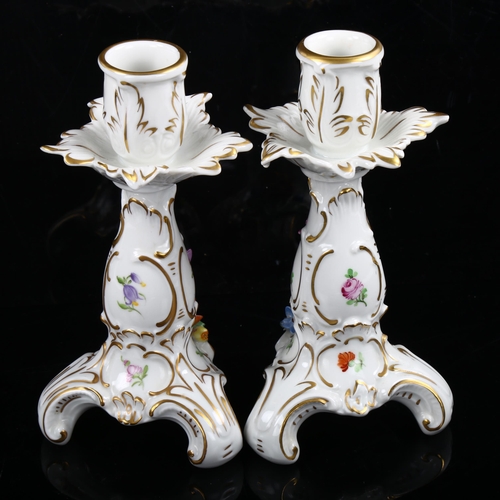 1216 - A pair of Dresden gilded porcelain candlesticks with floral mounts, height 16cm