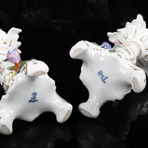 1216 - A pair of Dresden gilded porcelain candlesticks with floral mounts, height 16cm