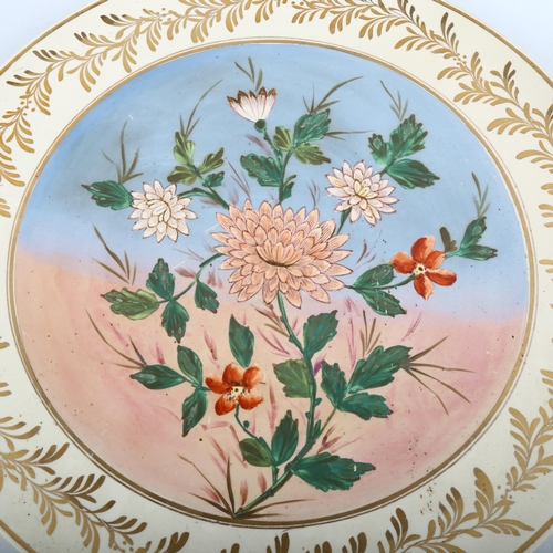 1219 - A large Royal Doulton pottery charger, with painted floral panel, diameter 50cm