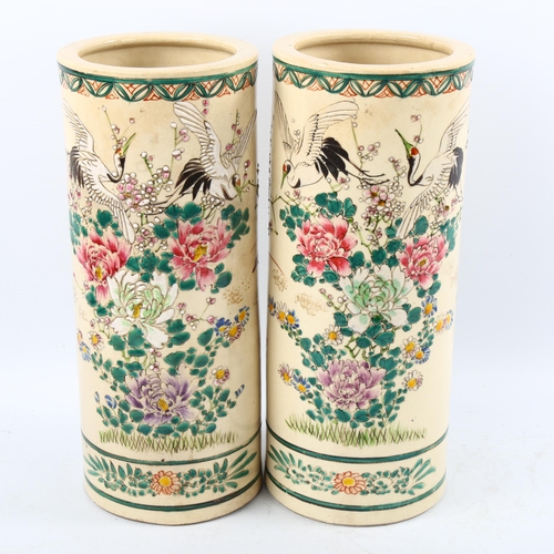 1221 - A pair of Chinese porcelain cylinder vases with painted enamel birds and flowers, signed, height 31c... 