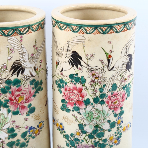 1221 - A pair of Chinese porcelain cylinder vases with painted enamel birds and flowers, signed, height 31c... 