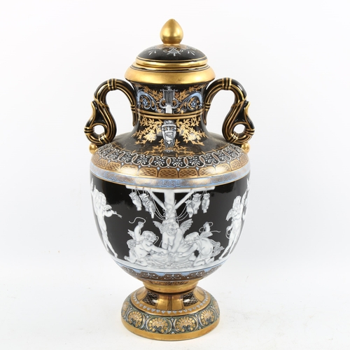 1226 - An ornate painted and gilded porcelain vase and cover, height 38cm