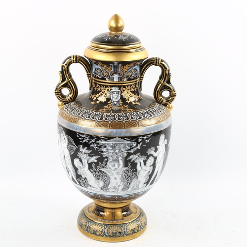 1226 - An ornate painted and gilded porcelain vase and cover, height 38cm