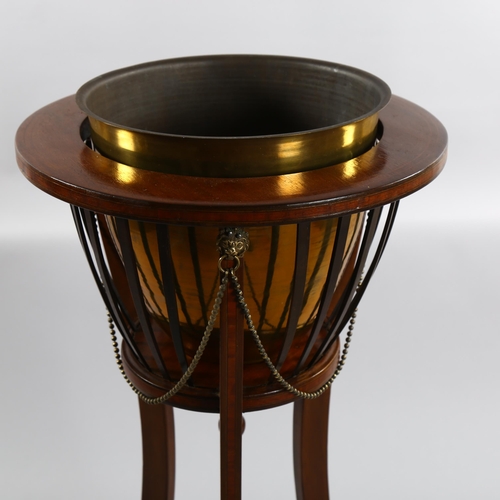 1240 - An Edwardian mahogany jardiniere with brass liner, diameter 40cm