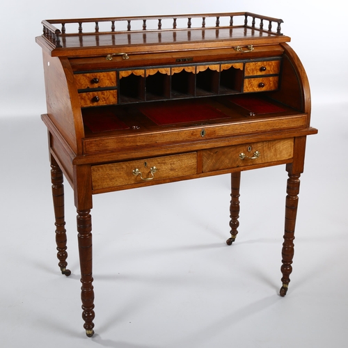 1243 - A Victorian walnut roll-top desk with tambour-front opening to reveal a pull-out leather-topped writ... 