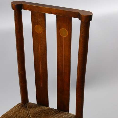 1244 - A Liberty style Art Nouveau beech sided chair, with inlaid back and rush seat, overall height 85cm