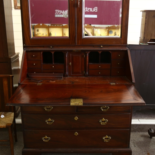 1246 - An impressive George III flame veneer mahogany bureau bookcase, with bevel mirror panelled cupboards... 