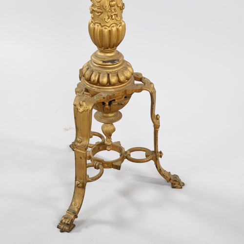 1268 - A 19th century cast bronze torcher stand, with spiral twist centre column and tripod base, height 12... 