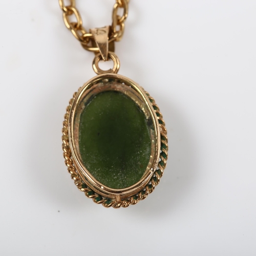 202 - A 14ct gold nephrite pendant necklace, on gilt-metal cable link chain, pendant height 23.7mm, chain ... 