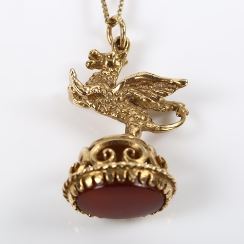 204 - A 9ct gold carnelian figural griffon fob seal, on gilt-metal fine curb link chain, fob height 31.2mm... 