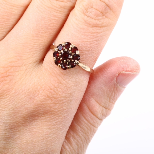 206 - A 9ct rose gold garnet cluster ring, setting height 10.8mm, size R, 2.7g