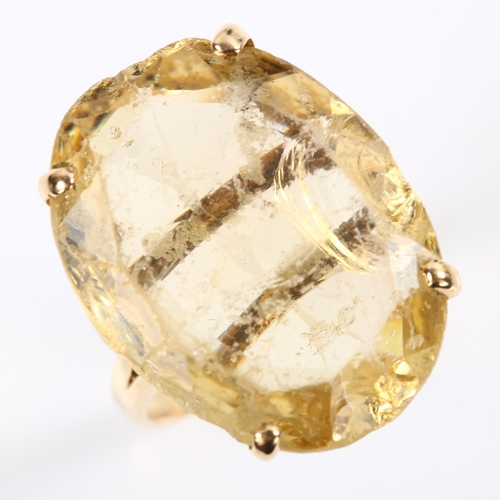 207 - A large 14ct gold citrine dress ring, set with oval mixed-cut citrine, length 22.4mm, size M, 7g