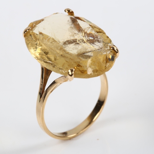 207 - A large 14ct gold citrine dress ring, set with oval mixed-cut citrine, length 22.4mm, size M, 7g