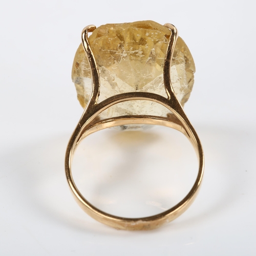 207 - A large 14ct gold citrine dress ring, set with oval mixed-cut citrine, length 22.4mm, size M, 7g