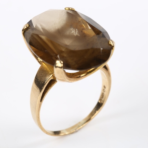 212 - A large late 20th century 9ct gold smoky quartz dress ring, set with oval mixed-cut quartz, length 2... 