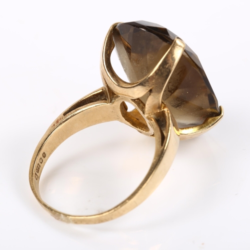 212 - A large late 20th century 9ct gold smoky quartz dress ring, set with oval mixed-cut quartz, length 2... 