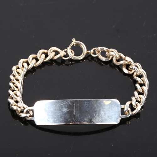 214 - A silver curb link identity bracelet, bracelet length 21cm, 39.8g