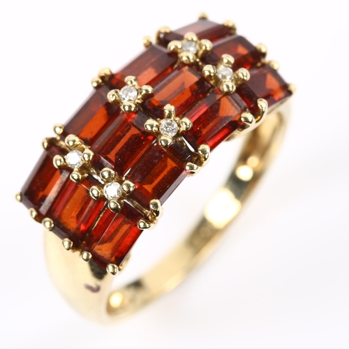 215 - A 9ct gold garnet and diamond dress ring, setting height 10.5mm, size R, 3.8g