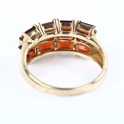 215 - A 9ct gold garnet and diamond dress ring, setting height 10.5mm, size R, 3.8g