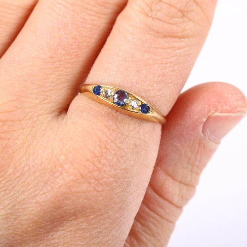 227 - An early 20th century 18ct gold graduated five stone sapphire and diamond half hoop ring, maker's ma... 