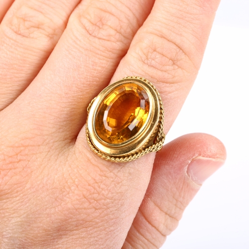 228 - A Continental 18ct gold citrine dress ring, with rope twist surround, setting height 22.4mm, size M,... 