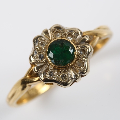 229 - An 18ct gold emerald and diamond cluster flowerhead ring, setting height 10.5mm, size T, 3.7g