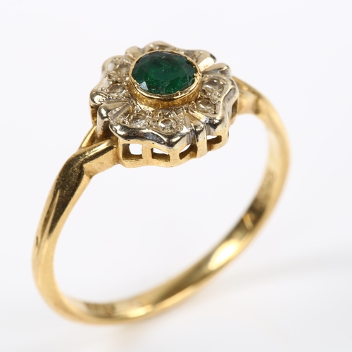 229 - An 18ct gold emerald and diamond cluster flowerhead ring, setting height 10.5mm, size T, 3.7g