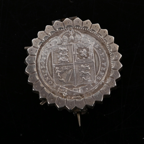 234 - A Victorian 1887 silver halfcrown coin brooch, in fluted frame, brooch diameter 28.4mm, 8.4g