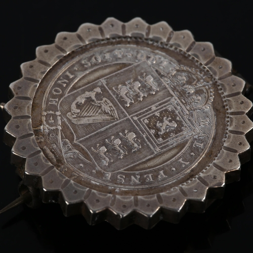 234 - A Victorian 1887 silver halfcrown coin brooch, in fluted frame, brooch diameter 28.4mm, 8.4g