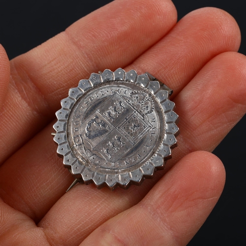 234 - A Victorian 1887 silver halfcrown coin brooch, in fluted frame, brooch diameter 28.4mm, 8.4g