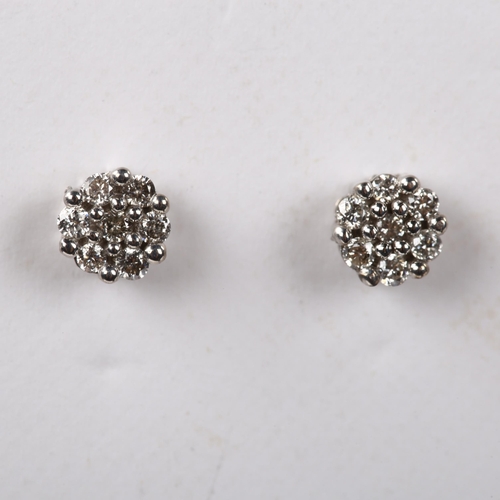 238 - A pair of diamond cluster earrings, 18ct white gold tops with 9ct stud fitting, set with modern roun... 