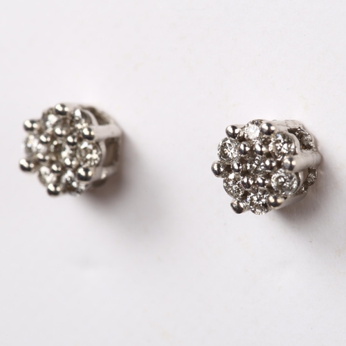 238 - A pair of diamond cluster earrings, 18ct white gold tops with 9ct stud fitting, set with modern roun... 