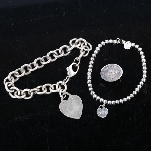 239 - TIFFANY & CO - a group of silver jewellery, comprising heart tag bracelet, heart charm ball bracelet... 