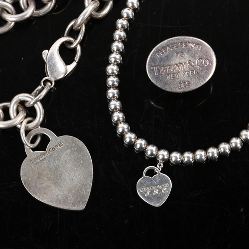 239 - TIFFANY & CO - a group of silver jewellery, comprising heart tag bracelet, heart charm ball bracelet... 