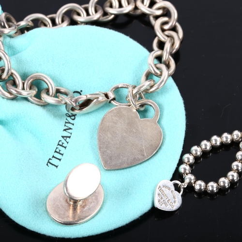 239 - TIFFANY & CO - a group of silver jewellery, comprising heart tag bracelet, heart charm ball bracelet... 