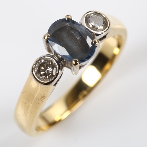 241 - An 18ct gold three stone sapphire and diamond ring, set with oval mixed-cut sapphire and modern roun... 