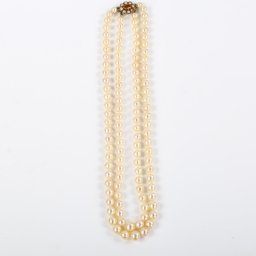 244 - A mid-20th century double-strand graduated pearl necklace, with 9ct citrine and split pearl clasp, h... 